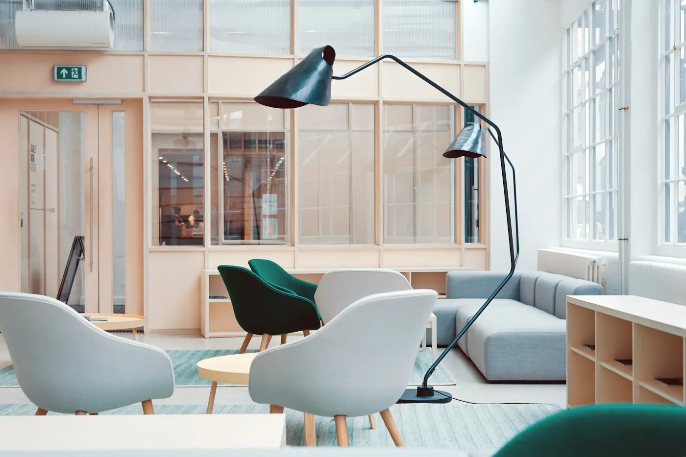 Office lounge with soft seating and glazed partitions