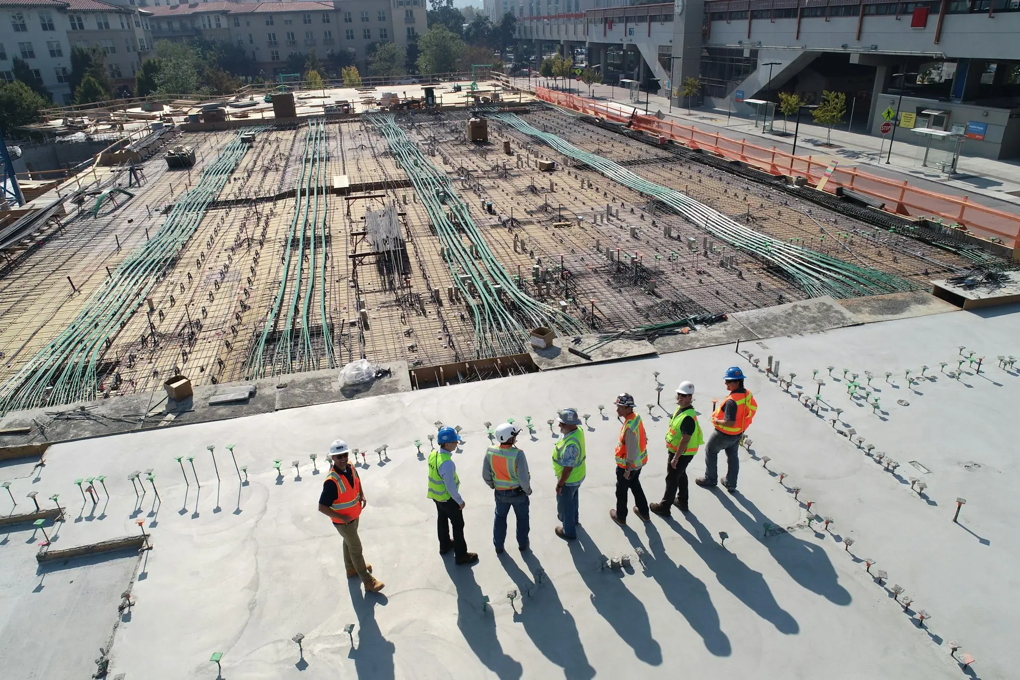 Engineers and site crew inspecting a large construction site